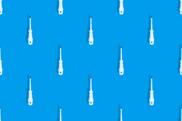 Metal screwdriver with rubber pads.Screwdriver seamless pattern.