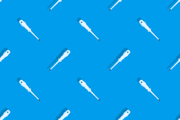 Metal screwdriver with rubber pads.Screwdriver seamless pattern.