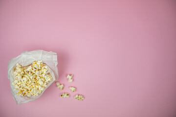 one bucket with popcorn on the pink background