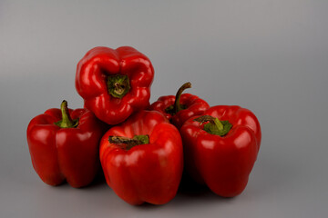 red bell pepper on gray background, food preparation process, proper nutrition