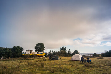 Camping on a bike tour 
through the Patagonia coastal landscape, Chile. 