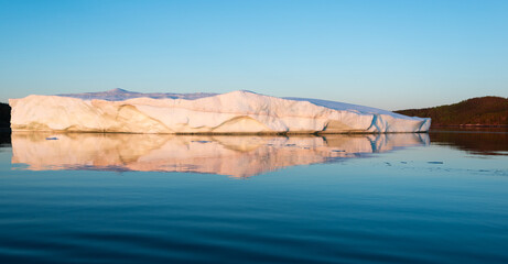 Iceberg Floating Along Coast