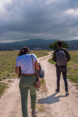 Obraz na płótnie Canvas Hiking couple walking, travel sport lifestyle concept
