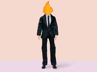 male doll in a business suit with fire instead of a head, stress and emotional burnout concept