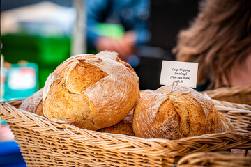 Retail display at stall stand bakery of large wapping French sourdough, Pain au Levain at Chelsea...