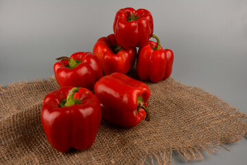 red bell pepper on gray background, food preparation process, proper nutrition