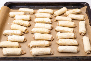 Raw dough products on a baking sheet.