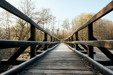 Timber bridge without people at winter time. See into the next year and into the futur