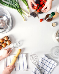Organic fresh vegetables and spices frame on wooden white background. Copyspace, top view.