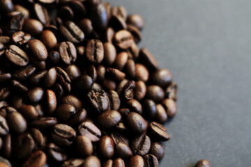 roasted coffee beans on black background