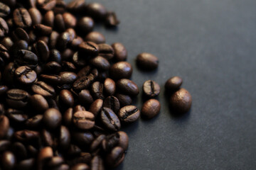 roasted coffee beans on black background