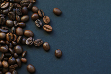 roasted coffee beans on black background