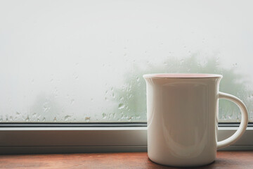 Cup of tea on the windowsill, close-up