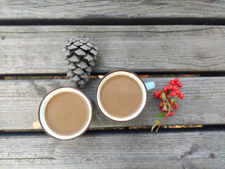 two cups of coffee on wooden table