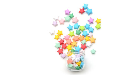 Colorful origami stars on white. Top view