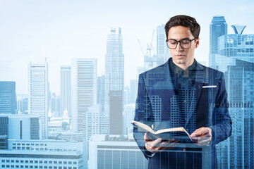 Young handsome businessman in suit and glasses thinking how to tackle the problem, new career opportunities, MBA assignment. Singapore on background. Double exposure.