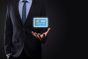 Business man in suit hand holding blank credit card icon showing for concept banking and finance service