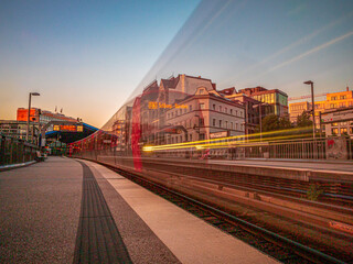 Fototapeta na wymiar Hamburg night with moving train during long exposure time