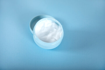 face cream on the blue table