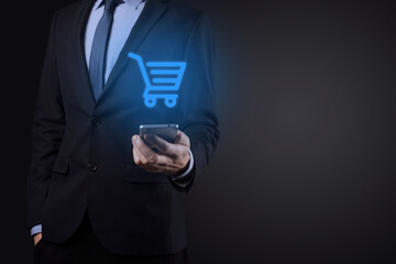 Businessman man holding shopping cart trolley mini cart in business digital payment interface.Business, commerce and shopping concept