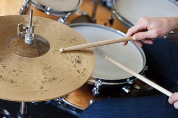 Fototapeta na wymiar Hands Playing Drum Set