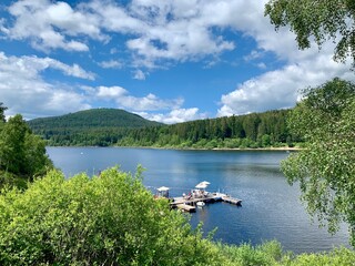 lake and mountains with a pier