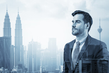 Fototapeta na wymiar Young handsome businessman in suit thinking how to succeed, new career opportunities, MBA. Kuala Lumpur on background. Double exposure.