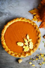 Homemade pumpkin pie with pastry crust, selective focus