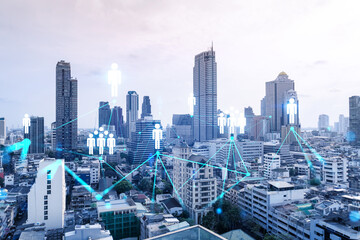 Obraz premium Social media icons hologram over panorama city view of Bangkok, Asia. The concept of people networking and connections. Double exposure.