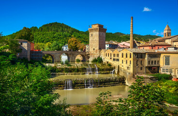 Fototapeta na wymiar Roman bridge, medieval tower and Metauro river. Fermignano, Marche, Italy.