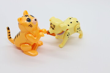 toy dog ​​and cat figures isolated in white color.