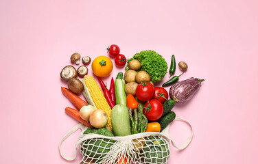 Different fresh vegetables on pink background, flat lay