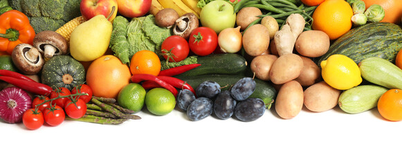 Assortment of fresh organic fruits and vegetables on white background