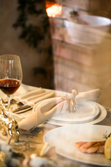 dinner in a restaurant with a glass of red wine and fish