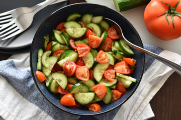 Cucumber and tomato salad.  Healthy and dietary food.  Weight loss program meal. 