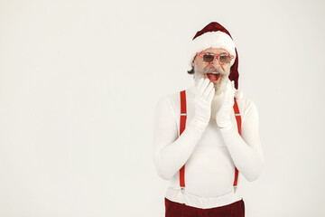 Fototapeta na wymiar Trendy grey-haired santa. Man wear knitted clothes. Grandfather in a santa's hat.