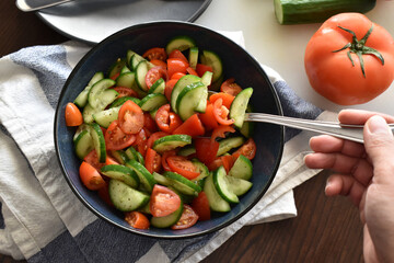 Cucumber and tomato salad.  Healthy and dietary food.  Weight loss program meal. 