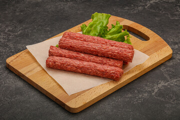 Raw beef sausages with spices