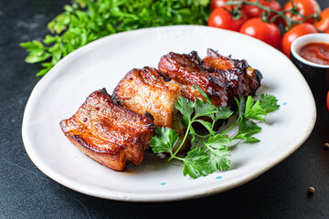 grilled ribs BBQ pork in spices and tomato sauce piece of meat second course snack ready to eat on the table healthy meal snack ingredient top view copy space for text food background rustic