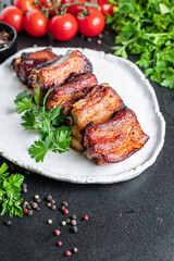 grilled ribs BBQ pork in spices and tomato sauce piece of meat second course snack ready to eat on the table healthy meal snack ingredient top view copy space for text food background rustic