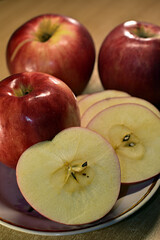 Ripe large red apples on the table.