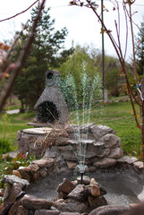 Outdoor landscape garden with pond and fountain