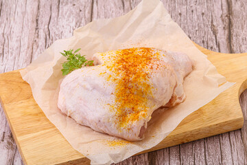 Raw chicken thigh with spices