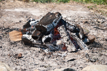 Camping bonfire with ash close-up view