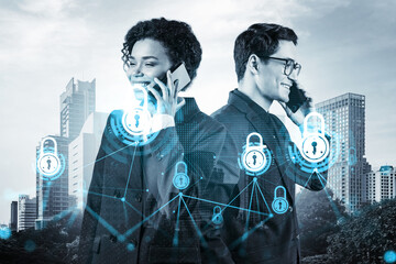 Businessman and businesswoman as a part of corporate team processing conference call to protect clients confidential information at cybersecurity compliance division. IT lock icons over Bangkok.