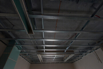 Installation of false ceilings. Construction site. Production of apartments, social housing.