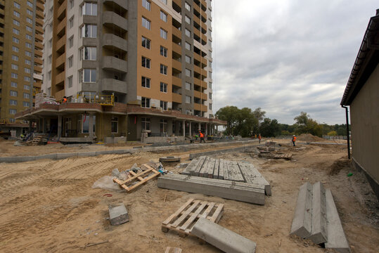 Laying the road, courtyard area. Construction site. production of apartments, social housing.
