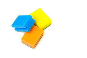 Dishwashing sponges of different colors on a white background. Close-up. Copy space.