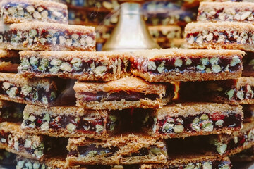 Turkish sweets baklava with nuts on the showcase