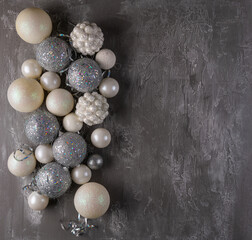 Festive mood, preparation for the holiday. New Year's festive decor in silvery colors - toys, star,...